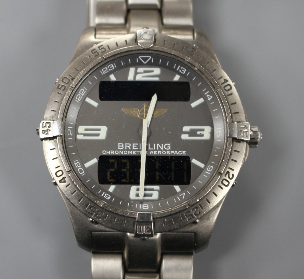 A gentlemans steel Breitling Aerospace quartz wrist watch, on Breitling bracelet.